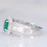Anello a fiore vintage in platino con smeraldo (0.81ct) e diamanti (0.93ctw), anni ‘80