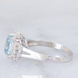 Anello a margherita vintage in platino con acquamarina (1.09ct) e diamanti (0.10ctw), anni ‘80/‘90