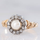 Anello a margherita antico in oro giallo 14K e argento con perla bianca e diamanti di taglio rosetta (0.13ctw ca.), primi del ‘900