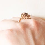 Anello a margherita vintage in oro giallo 9K con granati (1ctw ca.), anni ‘70