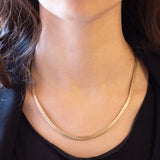 Collana vintage in oro giallo 8K con maglia omega