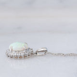 Collana vintage in platino con ciondolo con opale (1.78ct) e diamanti (0.56ctw)