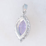 Ciondolo a margherita vintage in platino con tanzanite (0.81ct) e diamanti (0.37ctw)