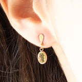 Orecchini pendenti vintage in oro giallo 9K con peridoti verdi (1ctw ca.)
