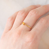 Solitario vintage in oro giallo 9K con spessartite (0.27ct ca.)