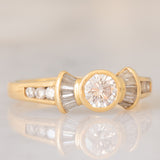 *RISERVATO* Anello “ballerina” in oro giallo 18K con diamanti di taglio brillante e di taglio tapered (0.71ctw ca.), anni ‘80