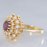 Anello a fiore vintage in oro giallo 14K con rubino (1ct ca.) e diamanti di taglio brillante (0.70ctw ca.), anni ‘70