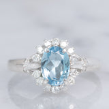 Anello a margherita vintage in platino con acquamarina (0.93ct) e diamanti (0.29ctw), anni ‘80