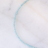Collana moderna con acquamarine, perla bianca e oro giallo 14K