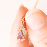 Collana vintage con catenina in oro giallo 9K e con ciondolo in oro giallo e bianco 9K con ametista (0.35ct ca.) e diamanti, anni ‘70