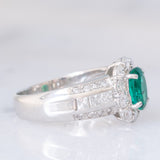Anello a fiore vintage in platino con smeraldo (0.81ct) e diamanti (0.93ctw), anni ‘80