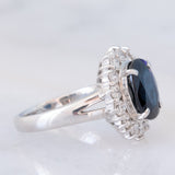 Anello a margherita vintage in platino con zaffiro (4.30ct) e diamanti (1.05ctw), anni ‘80