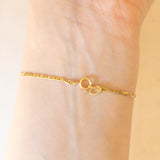 Braccialetto semirigido in oro giallo 14K con smeraldi (0.50ctw ca.) e diamanti (0.02ctw ca.), anni ‘70/‘80