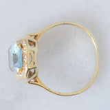 Anello vintage in oro giallo 14K con topazio azzurro (2.80ct ca.) e diamanti di taglio brillante (0.16ctw ca.), anni ‘80/‘90