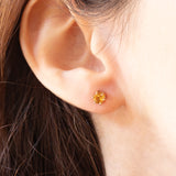 Orecchini punto luce vintage in oro giallo 9K con quarzi citrini (0.40ct ca.), anni ‘70