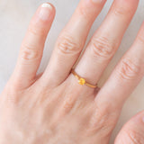 Solitario vintage in oro giallo 9K con spessartite (0.27ct ca.)