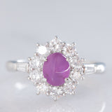 Anello a margherita vintage in platino con rubino stellato (1.35ct) e diamanti (0.66ctw ca.), anni ‘90