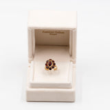 Anello vintage a margherita in oro giallo 8k e granati, anni '70