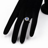 ANELLO VINTAGE A BALLERINA IN PLATINO CON ZAFFIRO (0.56CT) E DIAMANTI (0.46CTW)
