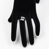 Anello vintage "bypass" in oto bianco 9k con topazio azzurro e diamanti