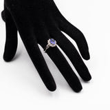ANELLO A MARGHERITA VINTAGE IN PLATINO CON TANZANITE (1CT) E DIAMANTI (0.50CTW)