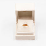 Anello trilogy in oro giallo 9k con granati arancioni (1,12ctw) e diamanti