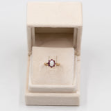 Anello vintage in oro giallo 9k con opale (0,50ct) e rubini (0,50ctw)