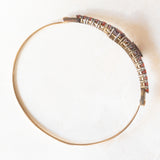 Braccialetto vintage con serpenti stilizzati in oro giallo 8K con granati (4ctw ca.), anni ‘60