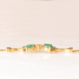 Braccialetto semirigido in oro giallo 14K con smeraldi (0.50ctw ca.) e diamanti (0.02ctw ca.), anni ‘70/‘80