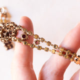 Braccialetto semirigido vintage in oro giallo 8K con granati, anni ‘60/‘70