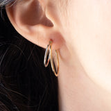 Orecchini vintage a doppio cerchio in oro giallo e in oro bianco 18K, anni ‘70/‘80