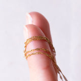 Collana con catenina in oro giallo 9K e con ciondolo in oro giallo 9K con opale e rubini sintetici, anni ‘80/‘90