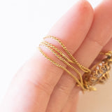 Collier con catenina in oro giallo 18K e con decorazione centrale convertita da orecchino antico in oro giallo 18K con diamanti di taglio rosetta (primi del ‘900)