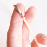 4 gioielli in 1: Collana vintage con perline bianche e con chiusura in argento e con pendente/spilla in oro giallo 14K con cammeo su agata e con perle bianche, anni ‘70