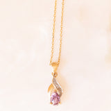 Collana vintage con catenina in oro giallo 9K e con ciondolo in oro giallo e bianco 9K con ametista (0.35ct ca.) e diamanti, anni ‘70