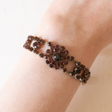 Braccialetto semirigido vintage in oro giallo 8K con granati, anni ‘60/‘70