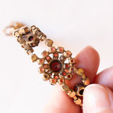 Braccialetto semirigido vintage in oro giallo 8K con granati, anni ‘60/‘70