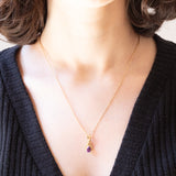 Collana vintage con catenina in oro giallo 9K e con ciondolo in oro giallo 9K con ametista (0.50ctw ca.) e diamanti (0.05ctw ca.), anni ‘70