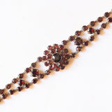 Braccialetto semirigido vintage in oro giallo 8K con granati, anni ‘60/‘70