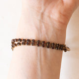 Braccialetto semirigido vintage in oro giallo 8K con granati, anni ‘60/‘70