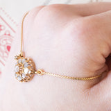 Collier con catenina in oro giallo 18K e con decorazione centrale convertita da orecchino antico in oro giallo 18K con diamanti di taglio rosetta (primi del ‘900)