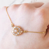 Collier con catenina in oro giallo 18K e con decorazione centrale convertita da orecchino antico in oro giallo 18K con diamanti di taglio rosetta (primi del ‘900)