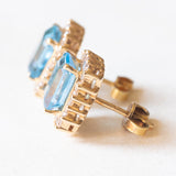 Orecchini a margherita vintage in oro giallo 14K con topazi azzurri (4.80ctw ca.) e diamanti di taglio brillante (0.72ctw ca.), anni ‘70/‘80