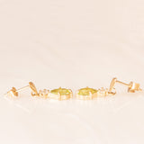 Orecchini pendenti vintage in oro giallo 9K con peridoti verdi (0.80ctw ca.) e imitazioni di diamanti, anni ‘80