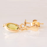 Orecchini pendenti vintage in oro giallo 9K con peridoti verdi (1ctw ca.)