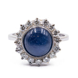 Vintage 18K gold ring with central cabochon sapphire and diamonds, 1960s