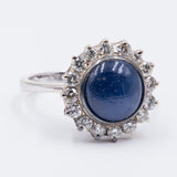 Vintage 18K gold ring with central cabochon sapphire and diamonds, 1960s