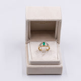 Anello vintage in oro giallo 18K con smeraldo (0.50ct ca.) e diamanti (0.12ctw ca.), anni '70