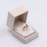Anello vintage in oro giallo 18K con smeraldo (0.50ct ca.) e diamanti (0.12ctw ca.), anni '70