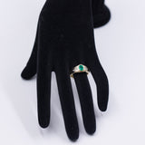 Anello vintage in oro giallo 18K con smeraldo (0.50ct ca.) e diamanti (0.12ctw ca.), anni '70
